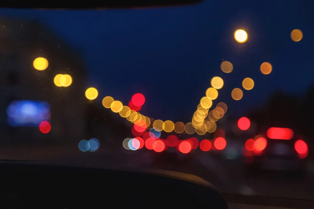 Glare and halos from headlights at night illustrating how cataracts can affect night driving